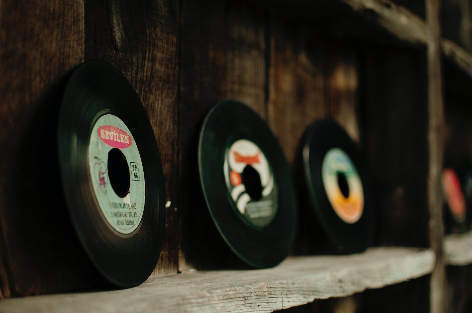 set of colorful vinyl records in old fashioned store